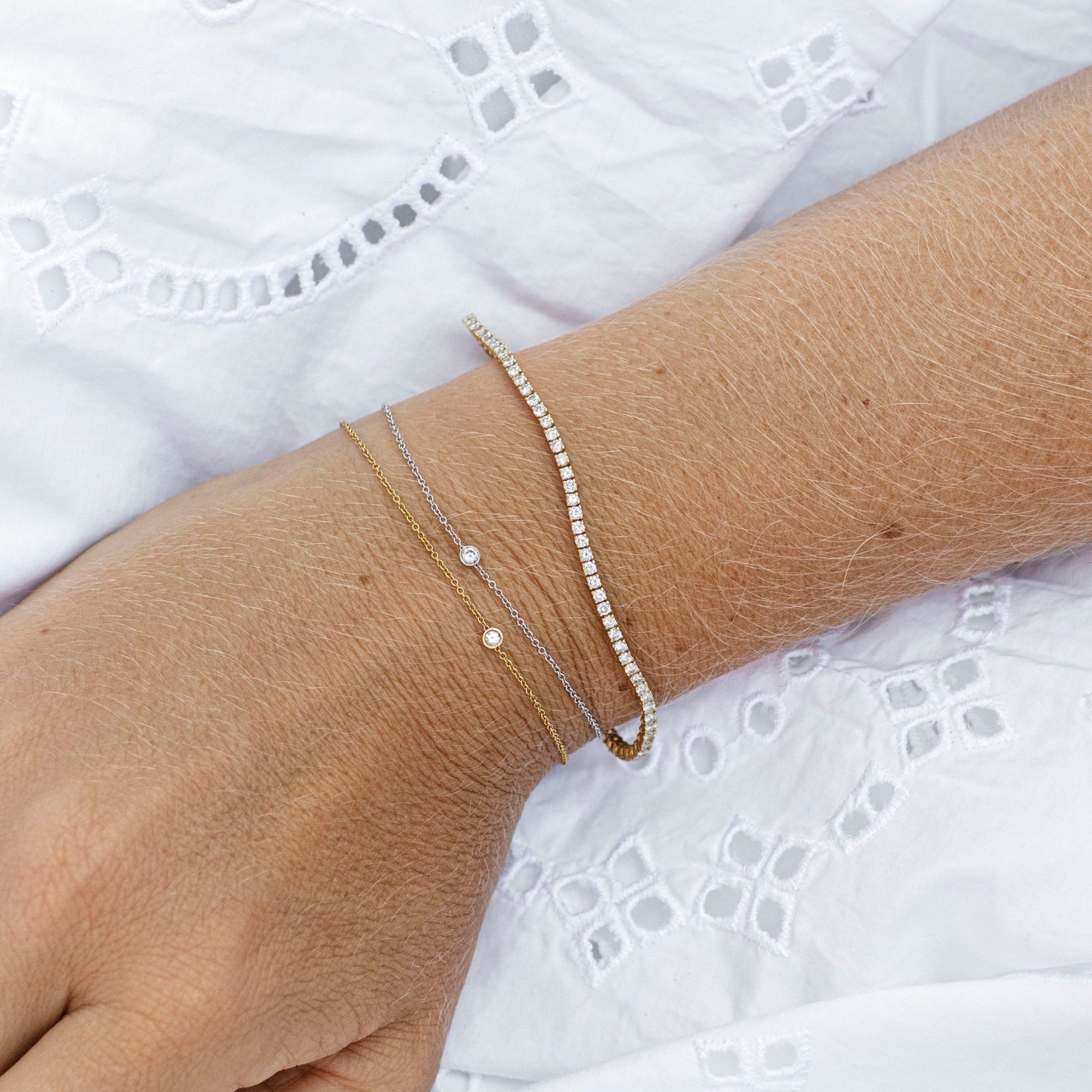 Elise tennisarmband, 18k gult guld / vitguld