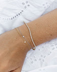Elise tennisarmband, 18k gult guld / vitguld