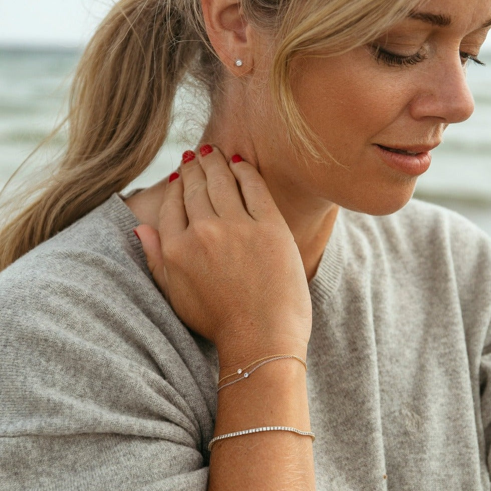 Elise tennisarmband, 18k gult guld / vitguld